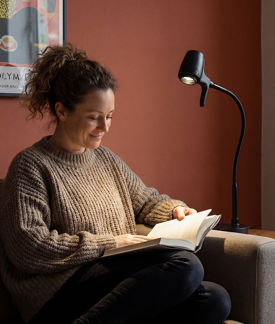 Woman reading with HD Pro table light