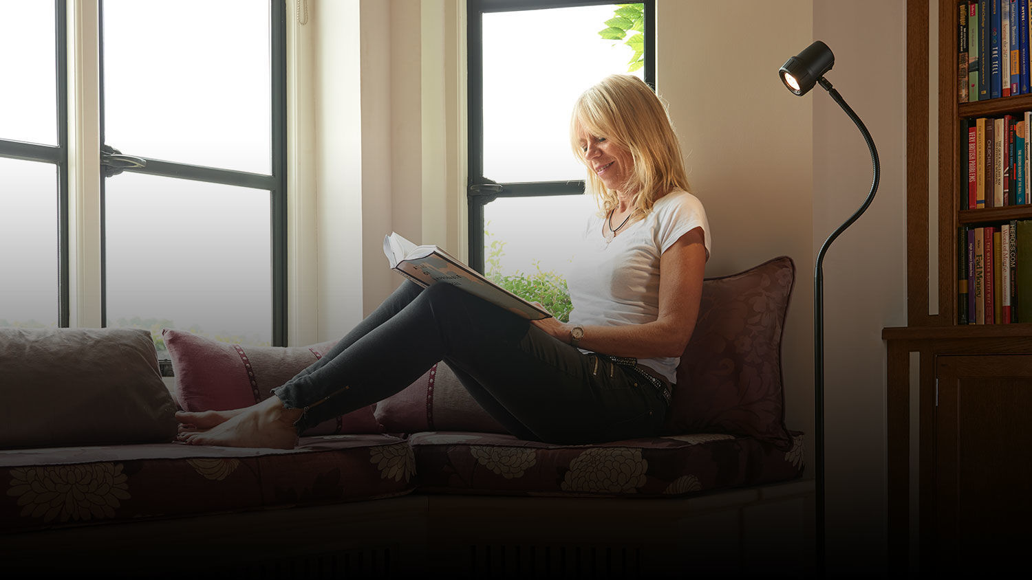 Man reading with HD Essential floor light