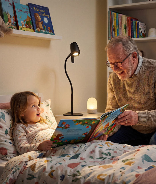 Man reading to child with HD Original table light