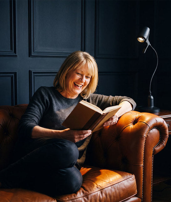 Woman reading with HD Original table light