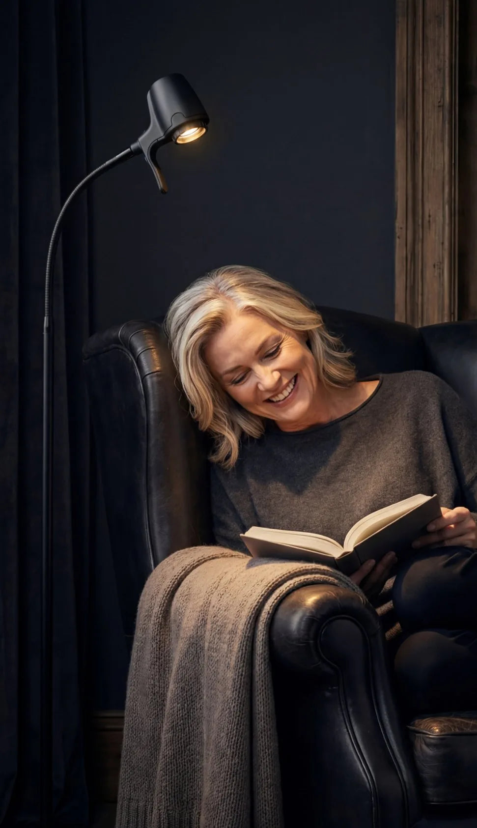 An HD Original floor light beside a reading chair